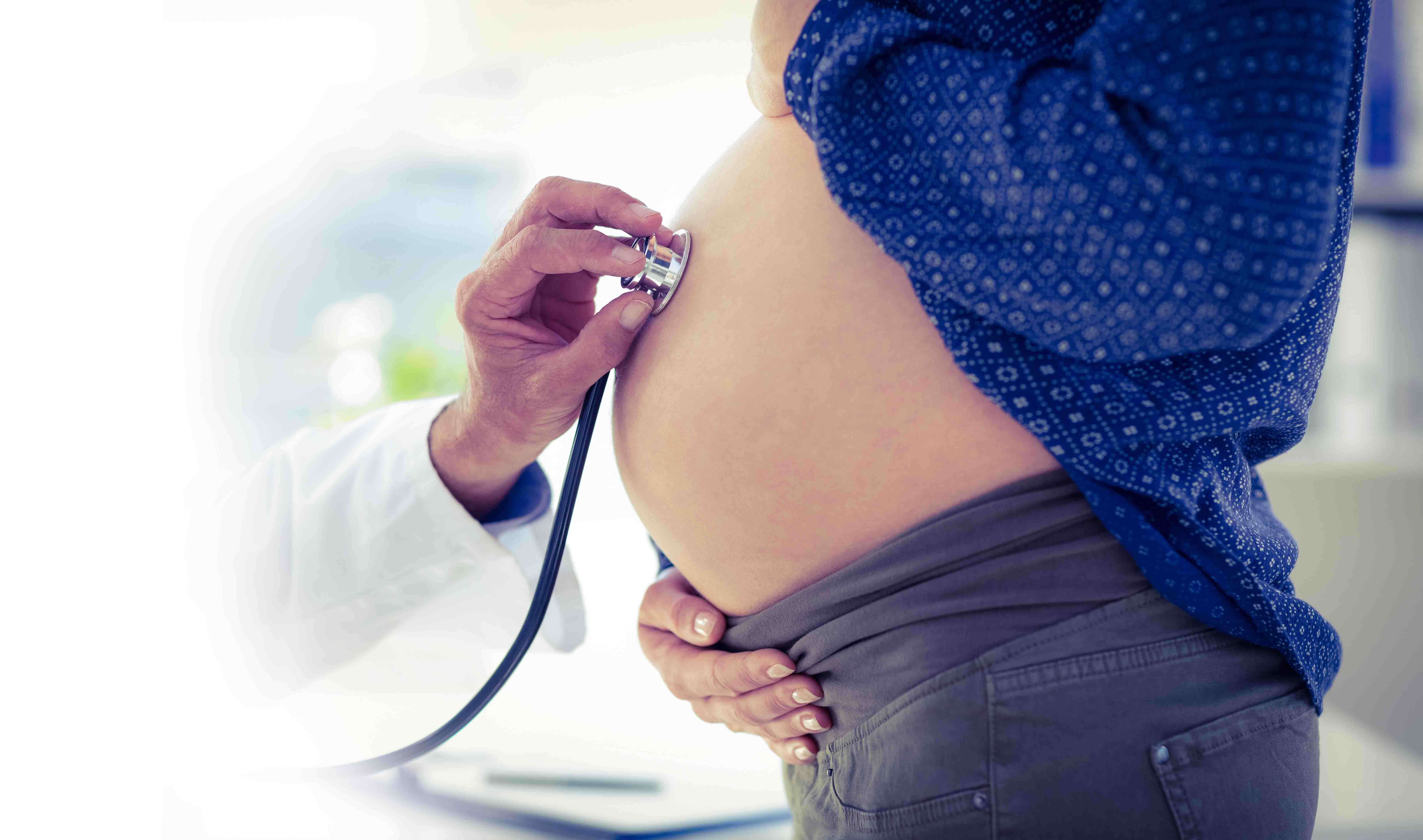 Fetal heartbeat check on a pregnant woman